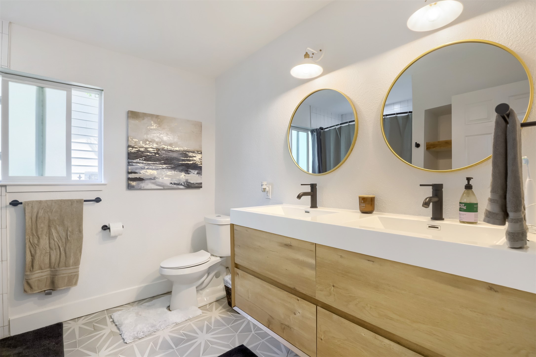 9016 West Pointer Lane Austin, TX 78758 - Photo 14 of 29 a bathroom with a toilet sink and mirror