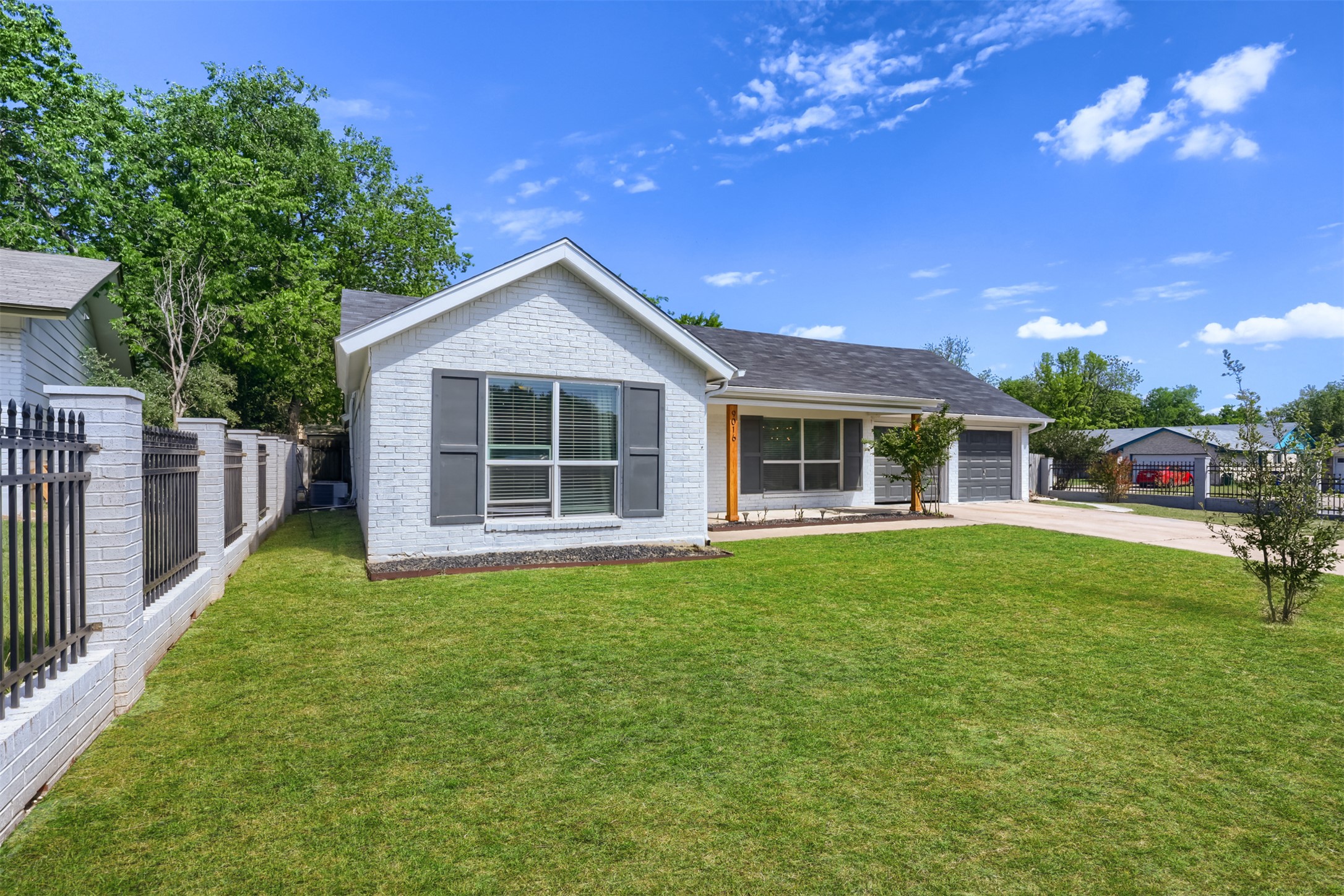 9016 West Pointer Lane Austin, TX 78758 - Photo 21 of 29 a front view of a house with a yard
