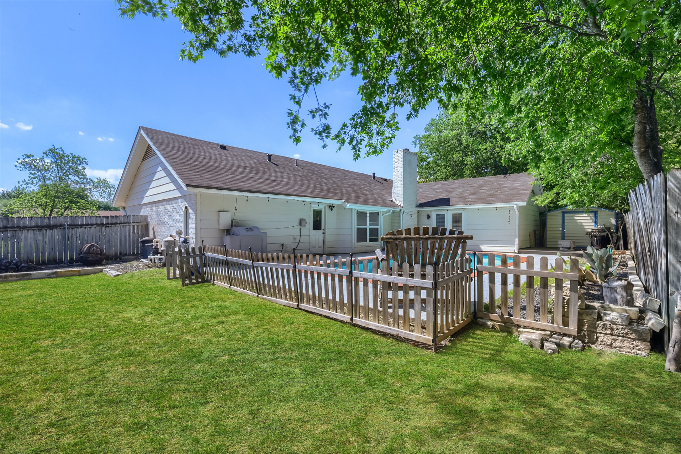 9016 West Pointer Lane Austin, TX 78758 - Photo 22 of 29 a view of a house with a yard and a deck