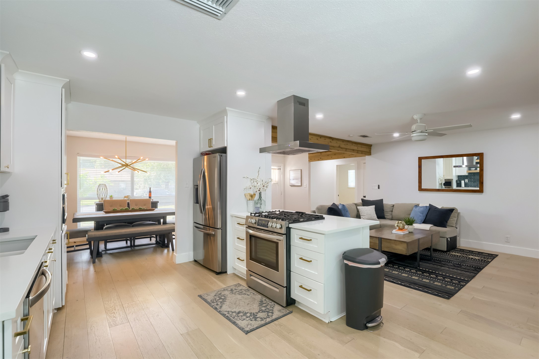 9016 West Pointer Lane Austin, TX 78758 - Photo 27 of 29 a kitchen with stainless steel appliances kitchen island granite countertop a stove and a refrigerator