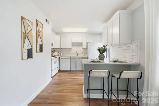 a kitchen with a sink cabinets and window