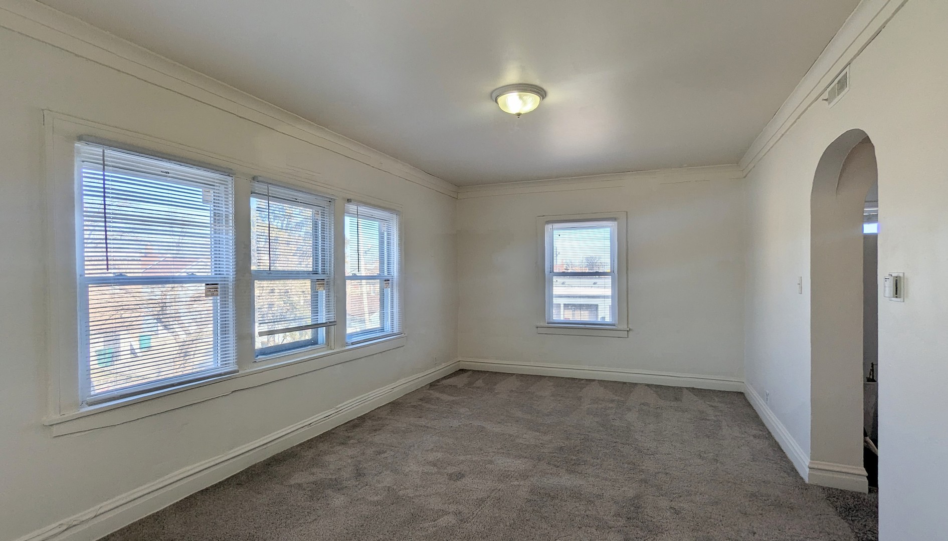 825 West Jefferson Street, Unit 2 Joliet, IL 60435 - Photo 2 of 6 an empty room with a window