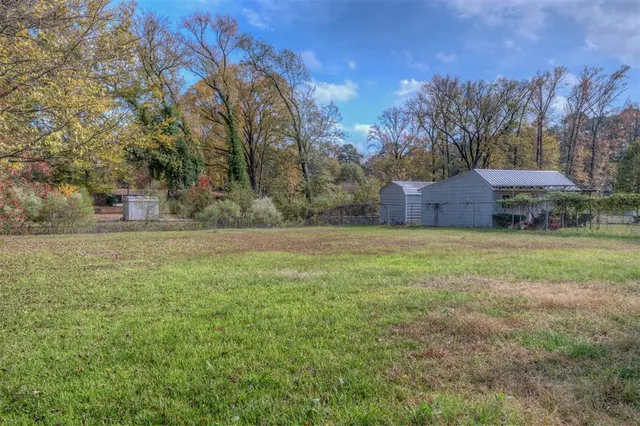 a house that has a tree in front of the house
