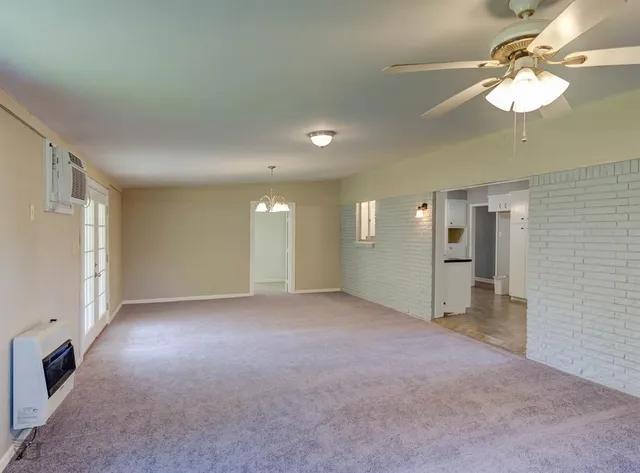 a view of a windows and chandelier in a room