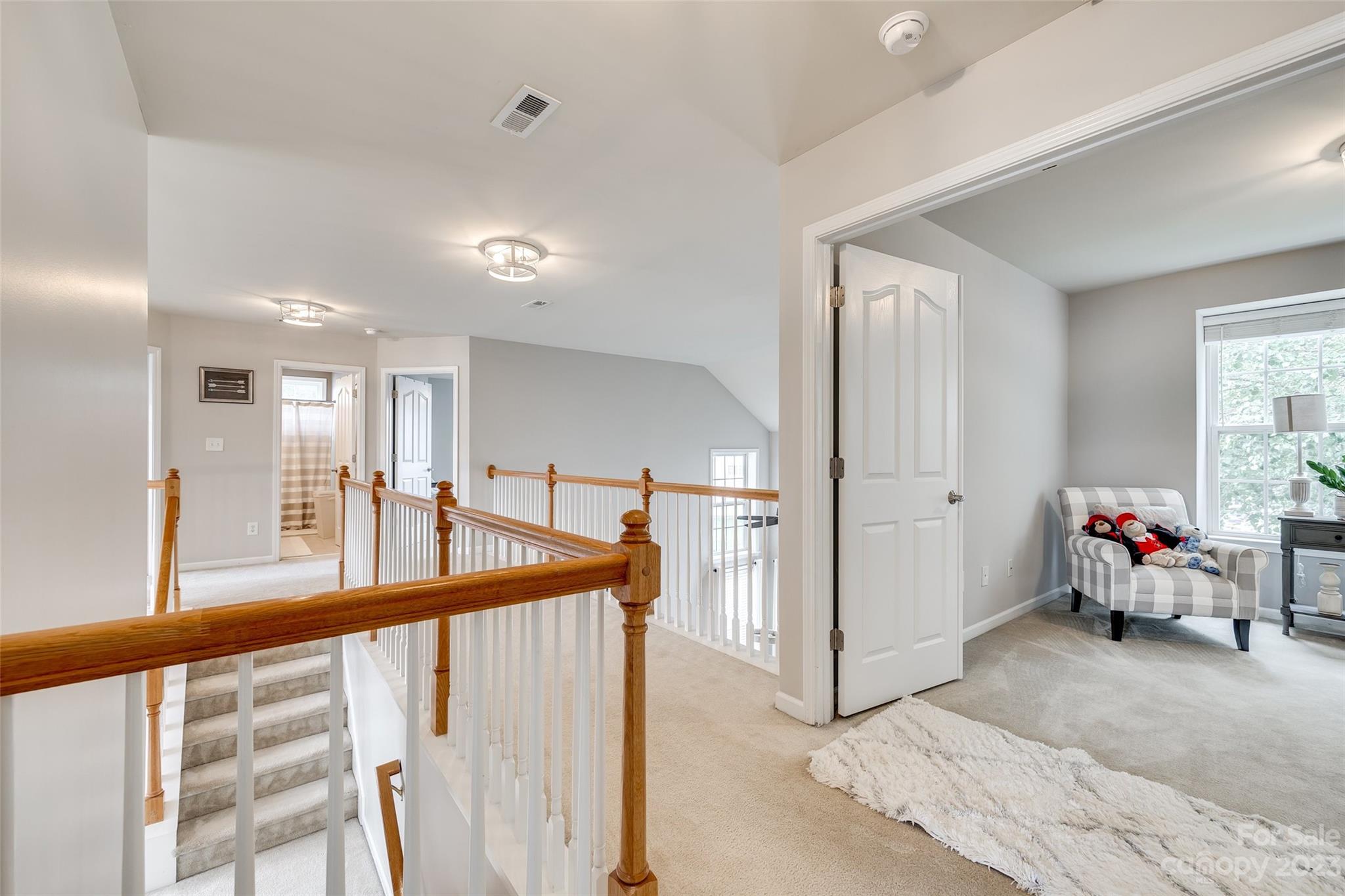 4722 Lapis Court Fort Mill, SC 29708 - Photo 20 of 47 a view of a hallway with livingroom and furniture