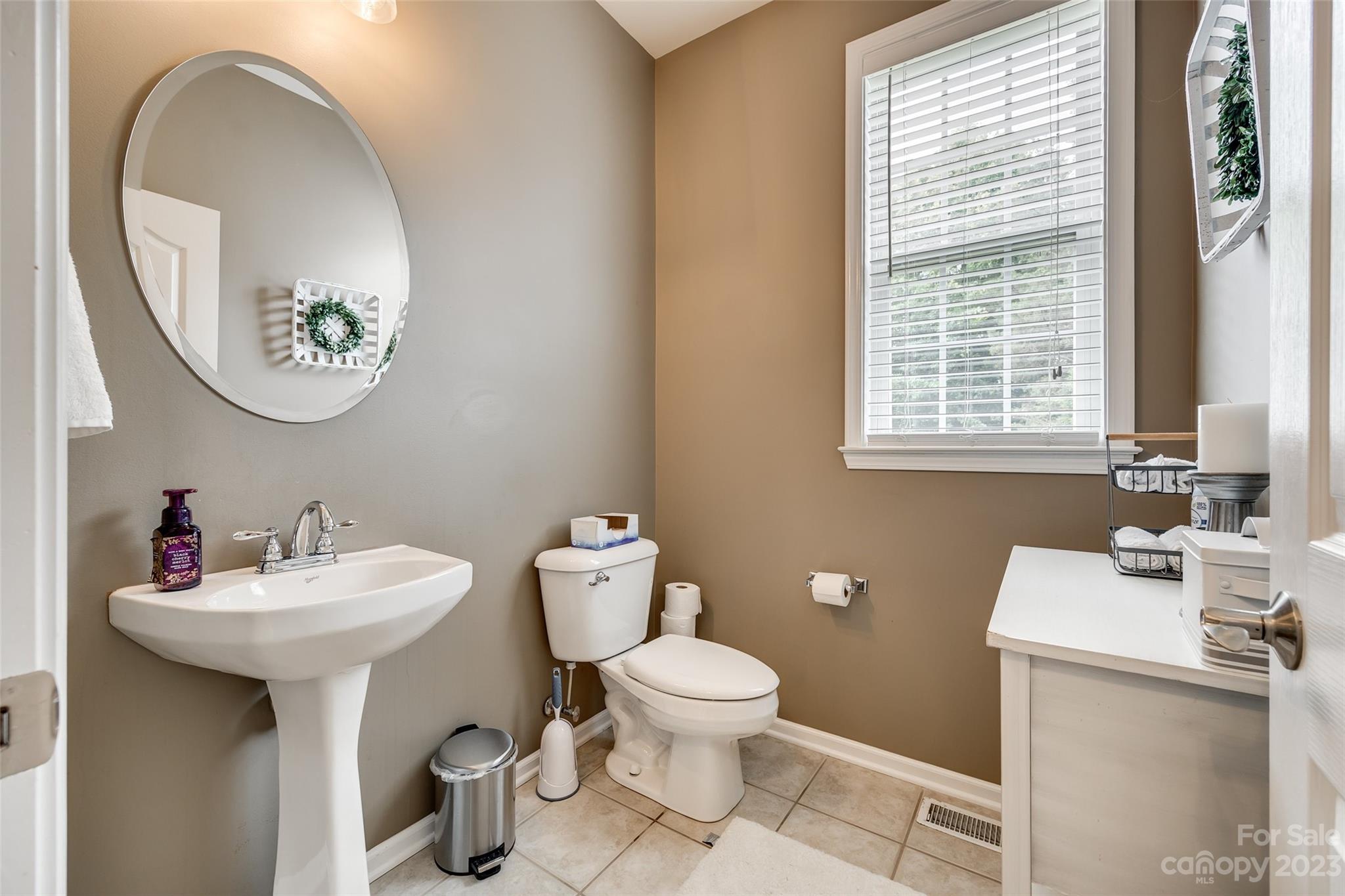 4722 Lapis Court Fort Mill, SC 29708 - Photo 9 of 47 a bathroom with a toilet a sink and a mirror