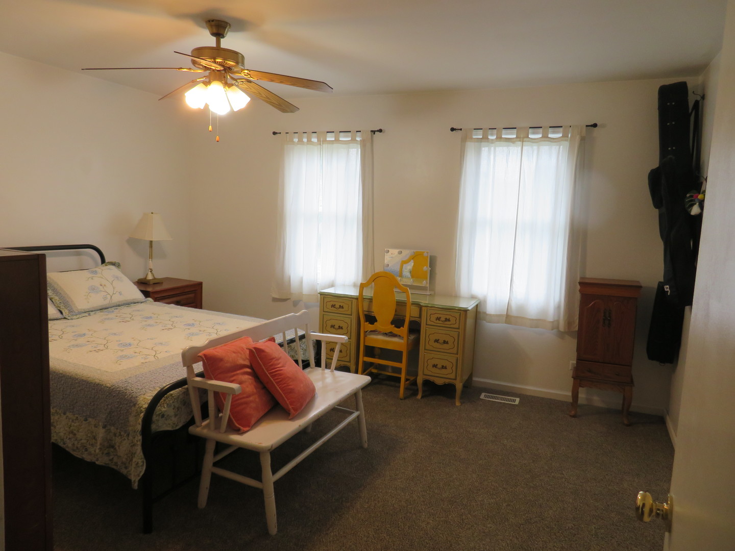 310 Rodenburg Road Roselle, IL 60172 - Photo 17 of 56 a bedroom with a bed and a chandelier