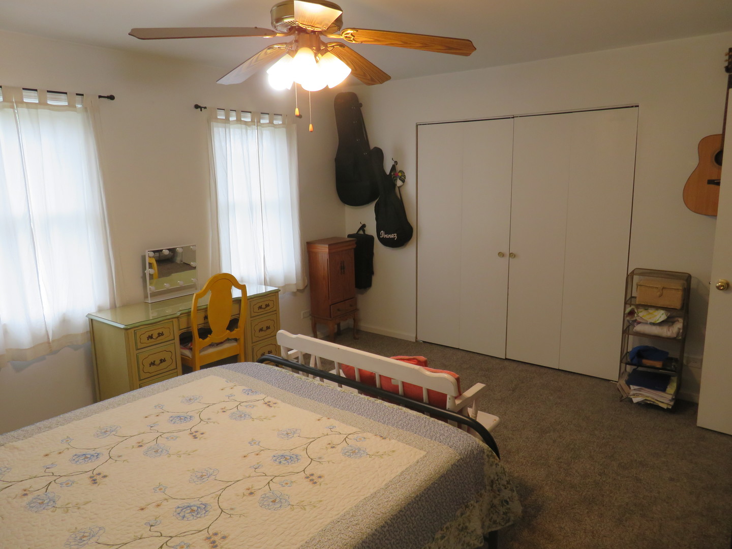 310 Rodenburg Road Roselle, IL 60172 - Photo 20 of 56 a bedroom with a bed and a chandelier
