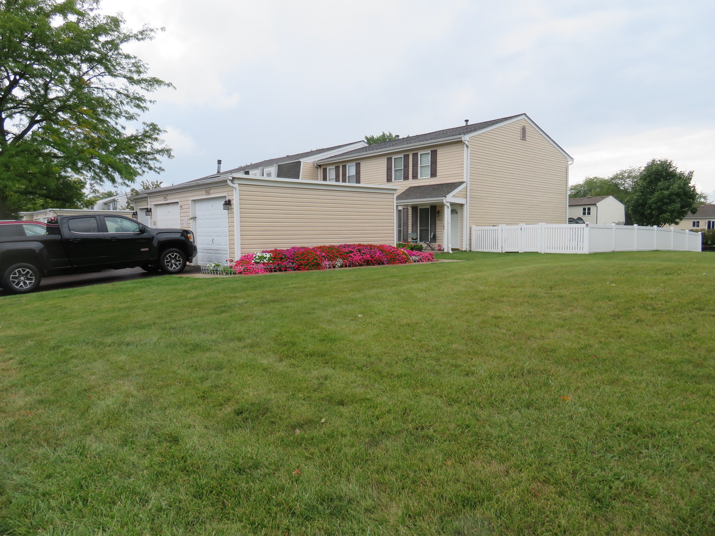 310 Rodenburg Road Roselle, IL 60172 - Photo 2 of 56 a view of a house with a big yard and large trees