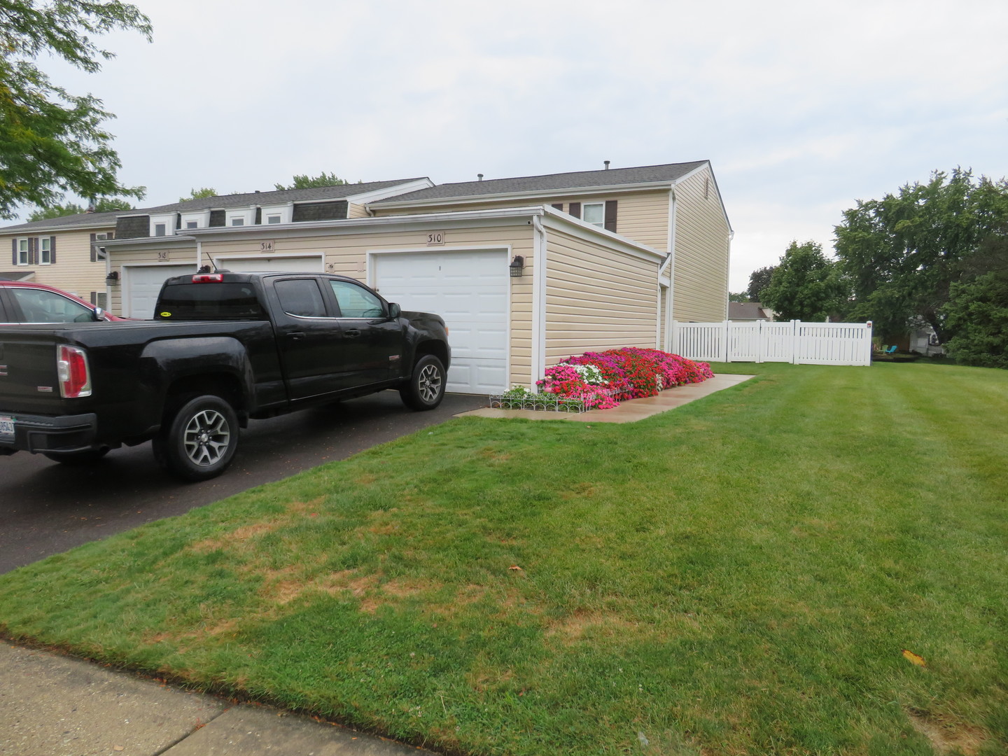 310 Rodenburg Road Roselle, IL 60172 - Photo 51 of 56 a view of a backyard with a car parked in it