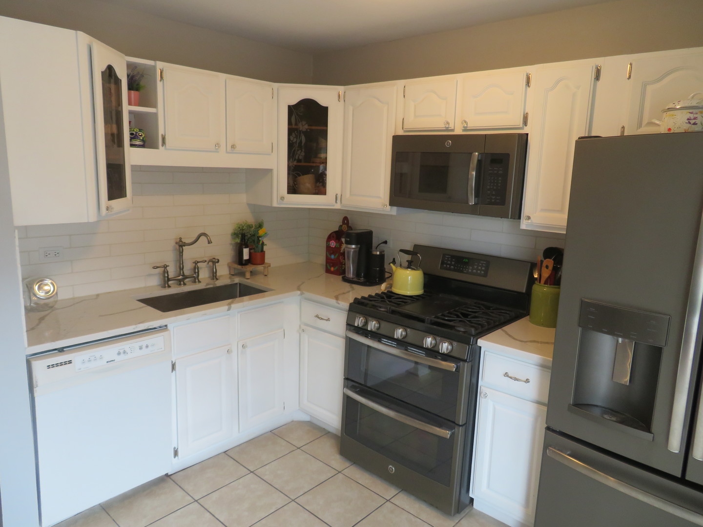 310 Rodenburg Road Roselle, IL 60172 - Photo 8 of 56 a kitchen with cabinets and appliances