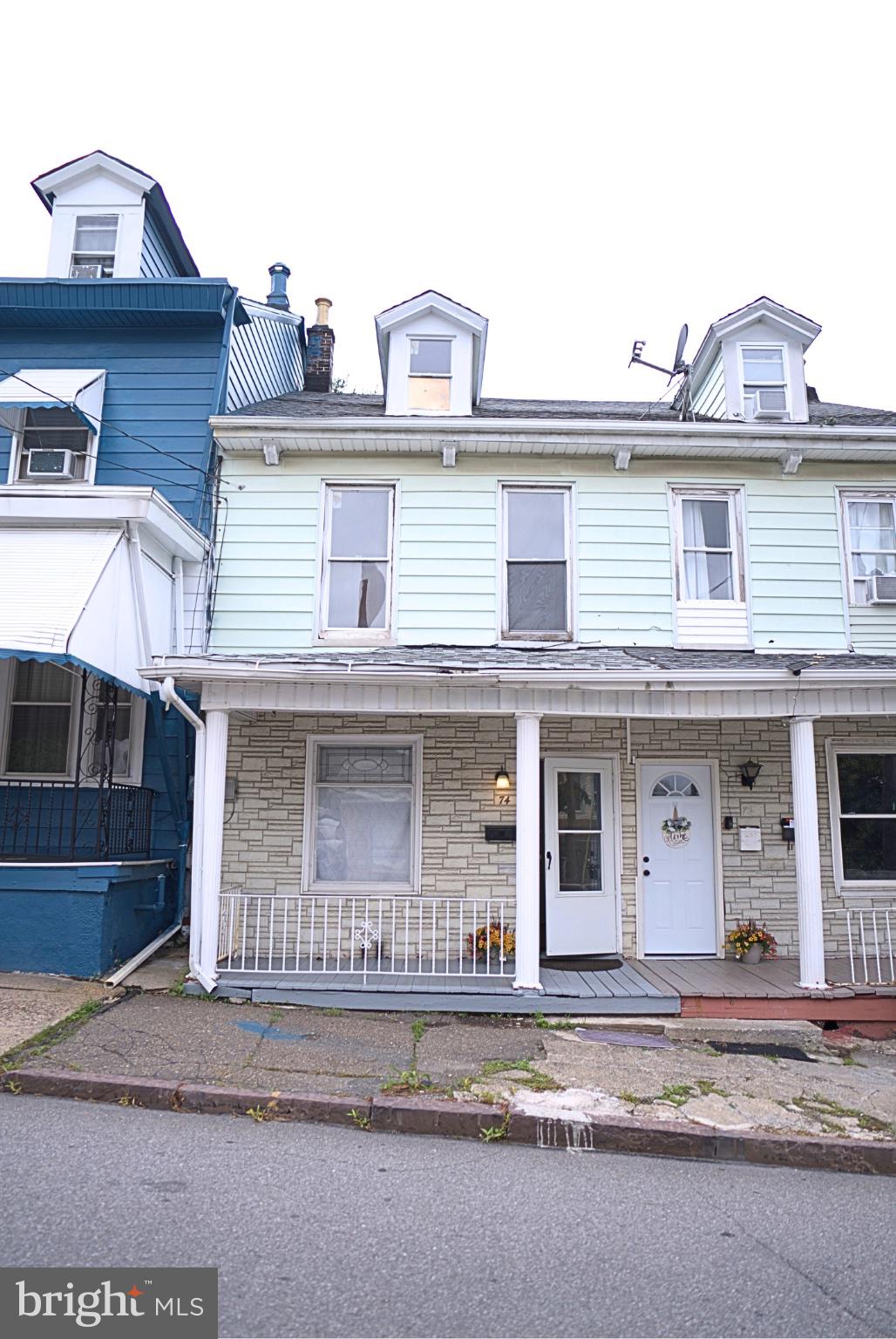 74 South Cedar Street Hazleton, PA 18201 - Photo 2 of 15 Charming multi-colored townhouse facade.