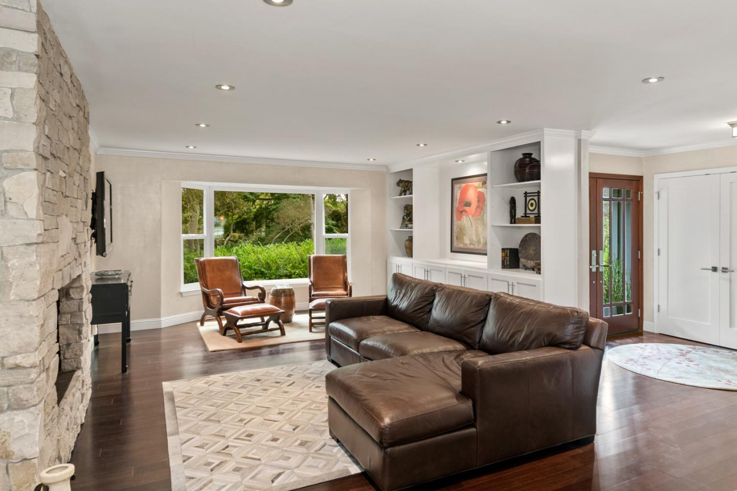 4089 Sunridge Road Pebble Beach, CA 93953 - Photo 5 of 42 a living room with furniture and a fireplace