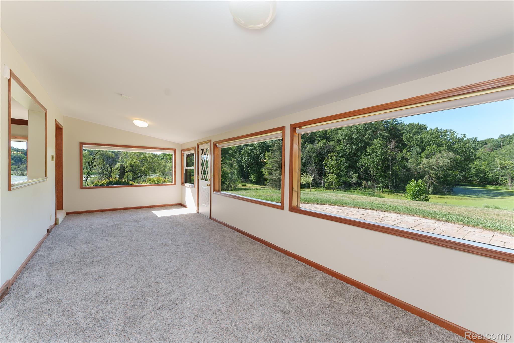 3166 Bigelow Road Howell, MI 48855 - Photo 14 of 50 Four Season room off kitchen with spectacular views of the property.