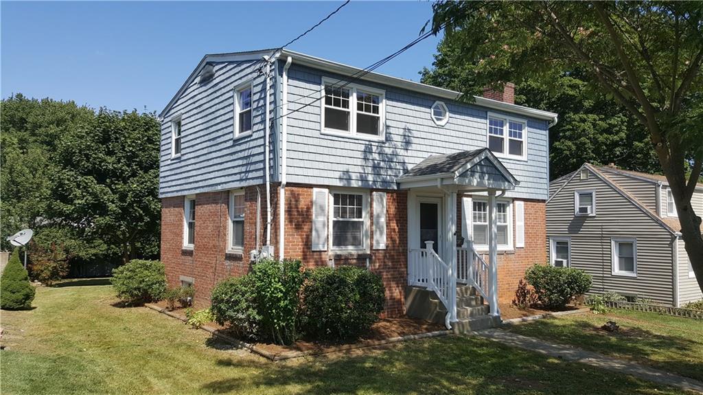 front view of a house with a yard