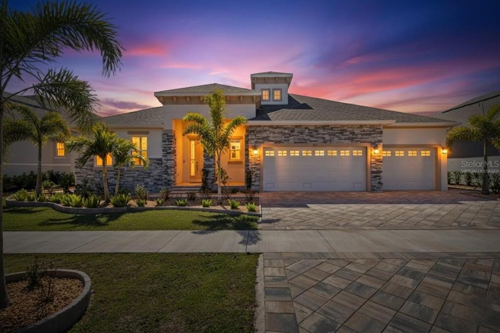 994 Signet Drive Apollo Beach, FL 33572 - Photo 5 of 98 a front view of a house with garden