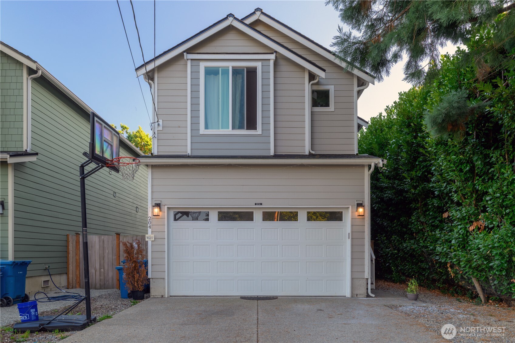 a front view of a house with a garage