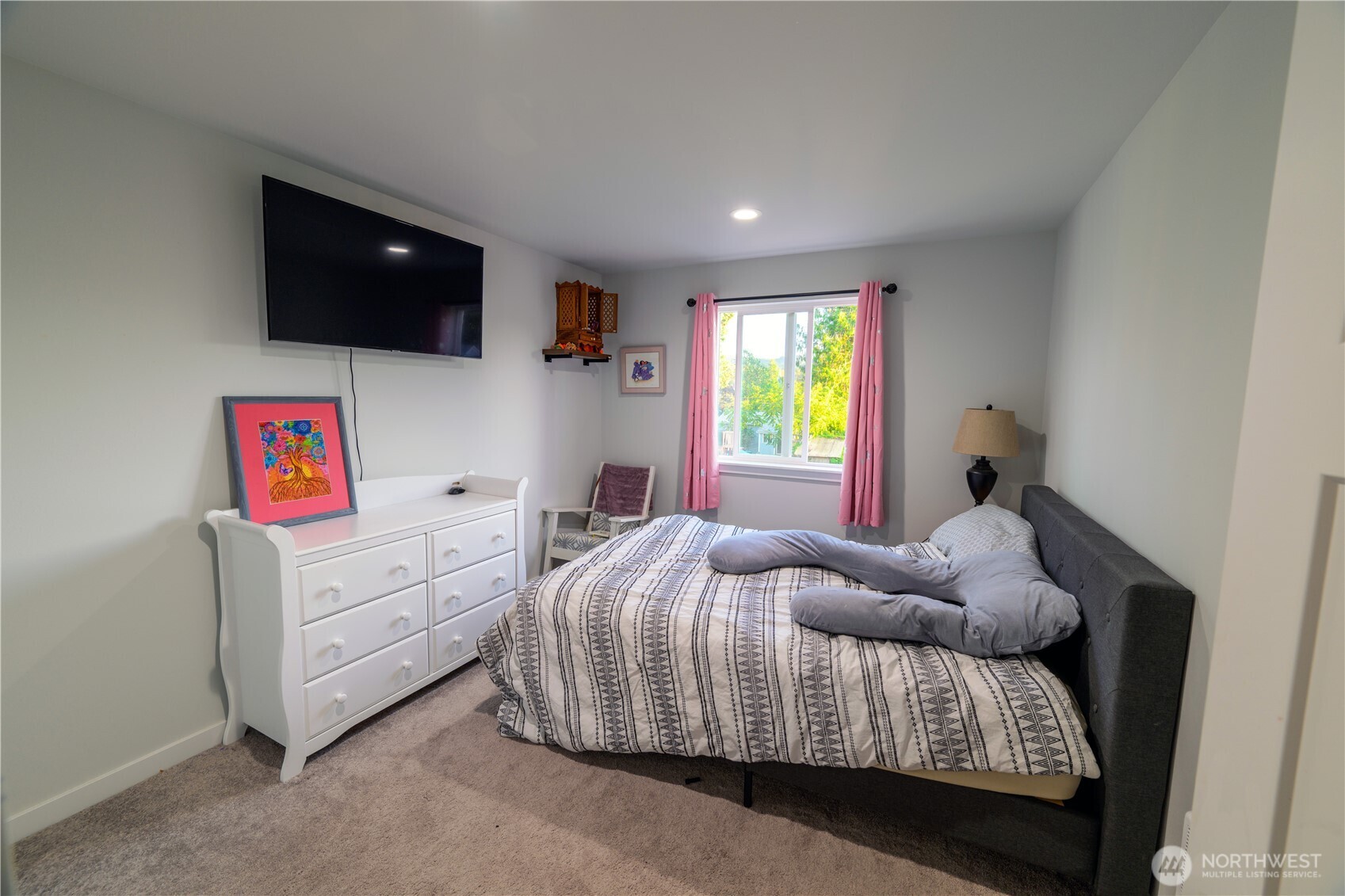 204 Date Avenue Sultan, WA 98294 - Photo 15 of 17 a bedroom with a bed and a flat screen tv