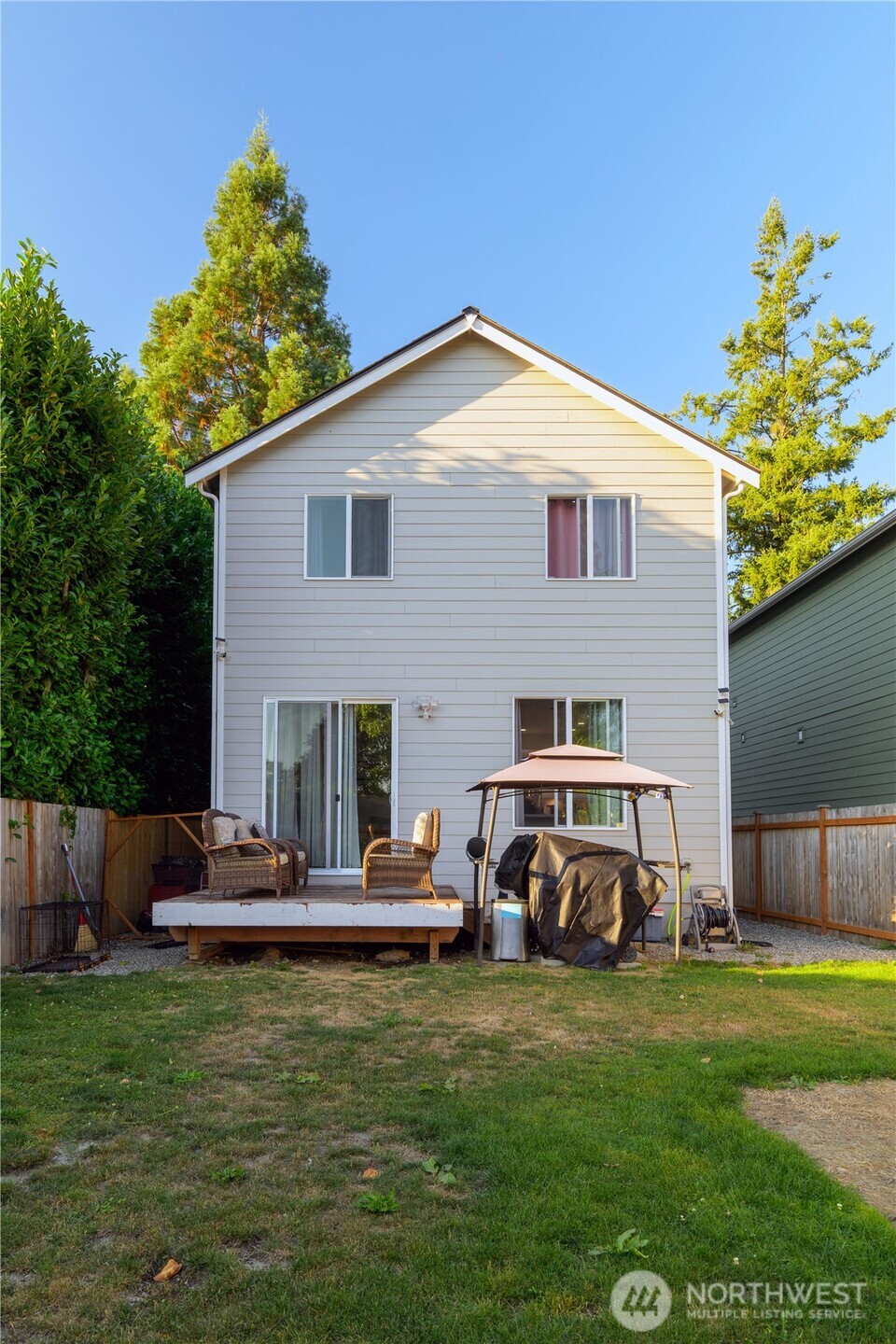 204 Date Avenue Sultan, WA 98294 - Photo 17 of 17 a front view of a house with a yard table and chairs