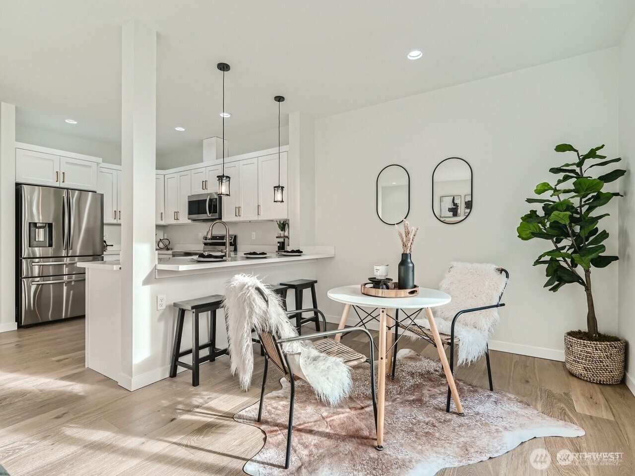 204 Date Avenue Sultan, WA 98294 - Photo 5 of 17 a kitchen with a table chairs refrigerator and cabinets