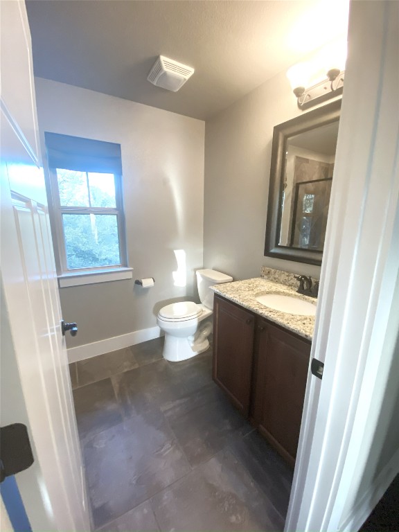 11200 Avery Station Loop, Unit 13 Austin, TX 78717 - Photo 28 of 39 a bathroom with a sink a toilet and a mirror