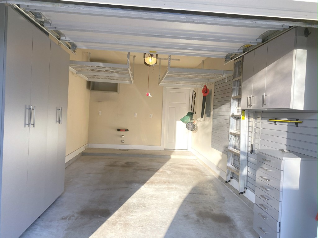 11200 Avery Station Loop, Unit 13 Austin, TX 78717 - Photo 30 of 39 a view of a hallway with a glass door shower