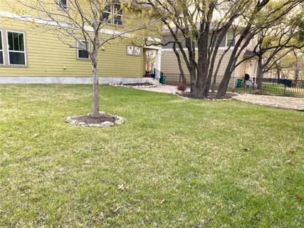 a backyard of a house with lots of green space