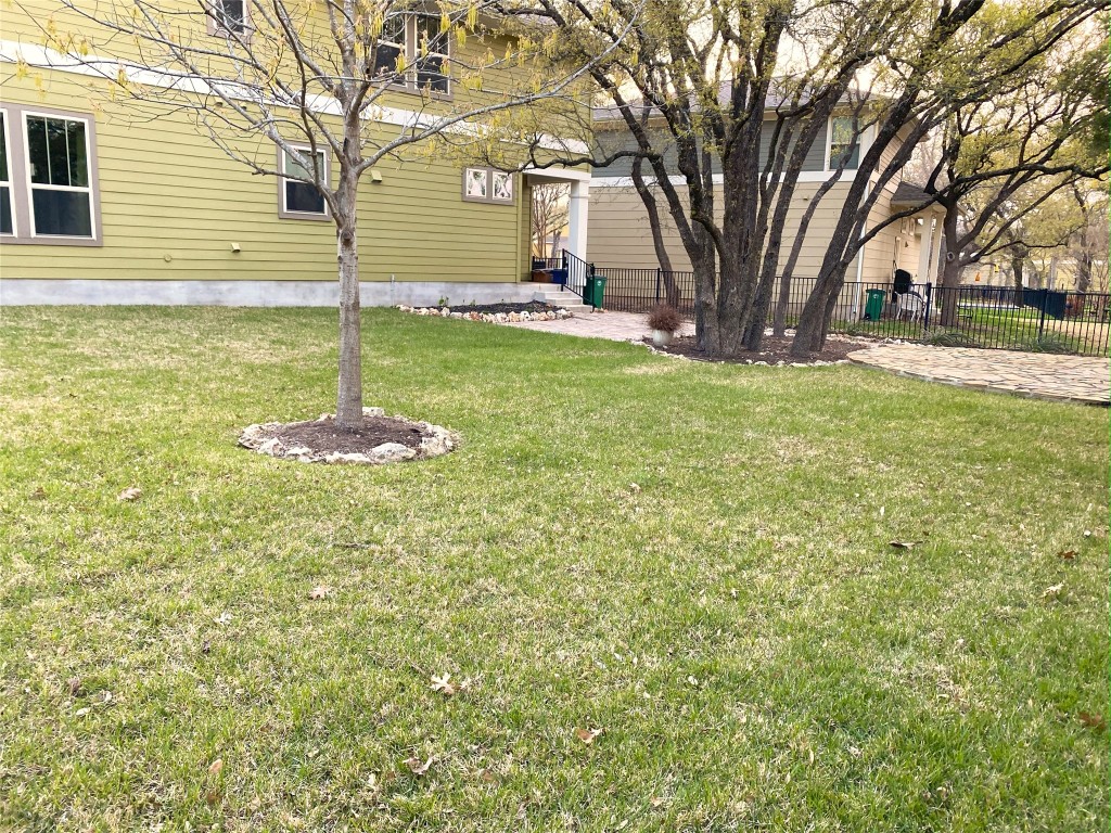 11200 Avery Station Loop, Unit 13 Austin, TX 78717 - Photo 34 of 39 a backyard of a house with lots of green space