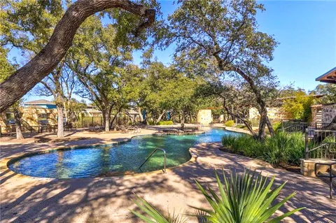 a view of a yard with swimming pool