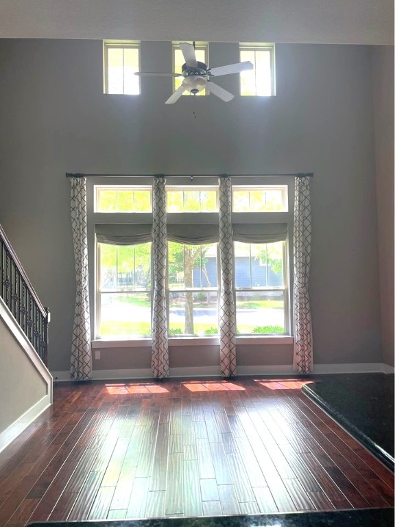 11200 Avery Station Loop, Unit 13 Austin, TX 78717 - Photo 4 of 39 a view of an empty room with wooden floor and a window