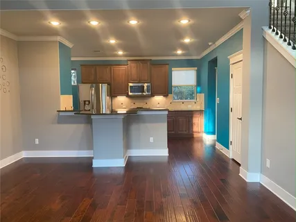 a open kitchen with a sink and dish washer