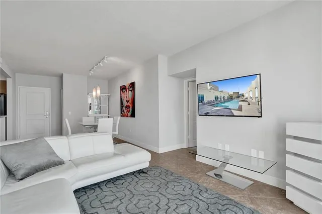 a living room with furniture and a rug