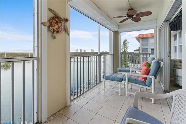 a view of a balcony with furniture