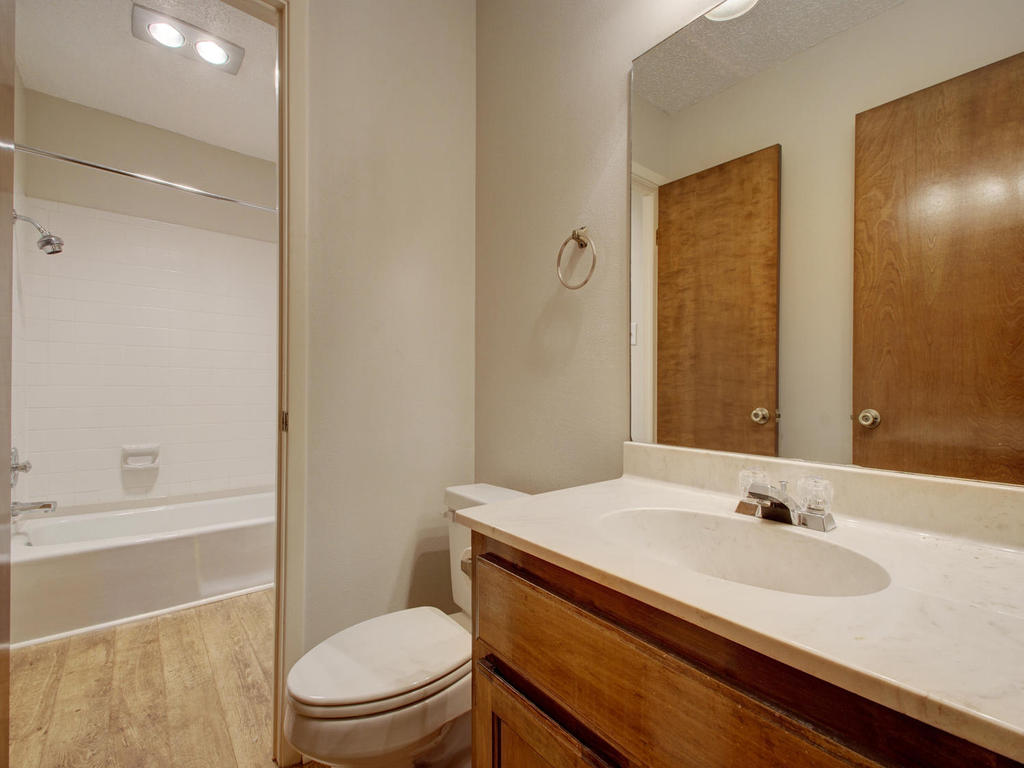 11301 Jollyville Road, Unit A3 Austin, TX 78759 - Photo 20 of 26 a bathroom with a sink a toilet and shower