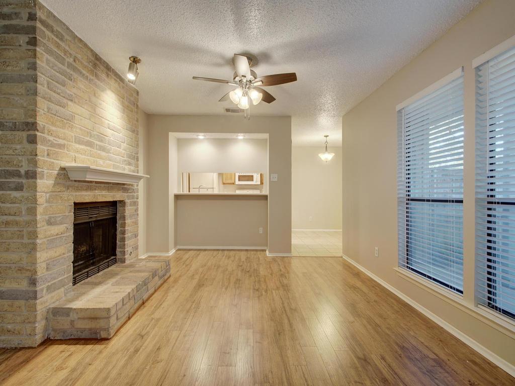 11301 Jollyville Road, Unit A3 Austin, TX 78759 - Photo 6 of 26 a view of an empty room with a kitchen and a window