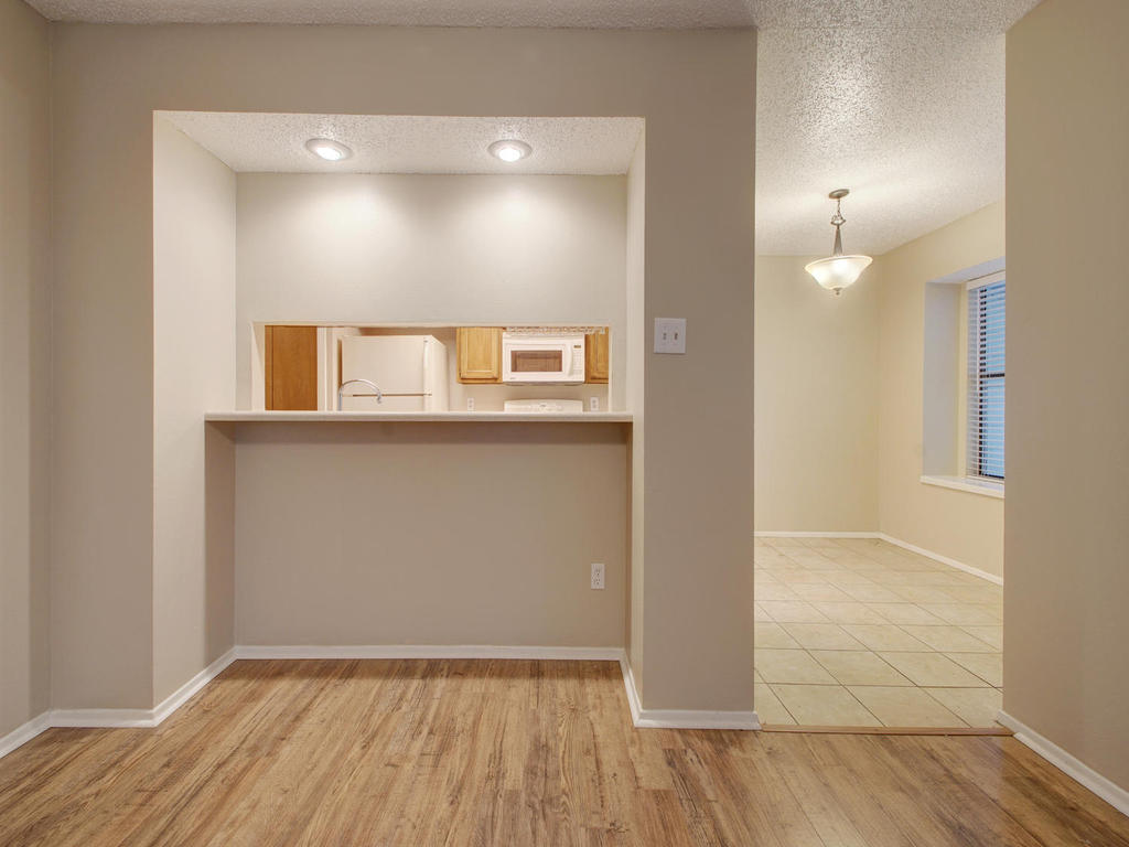 11301 Jollyville Road, Unit A3 Austin, TX 78759 - Photo 9 of 26 a view of a livingroom with wooden floor