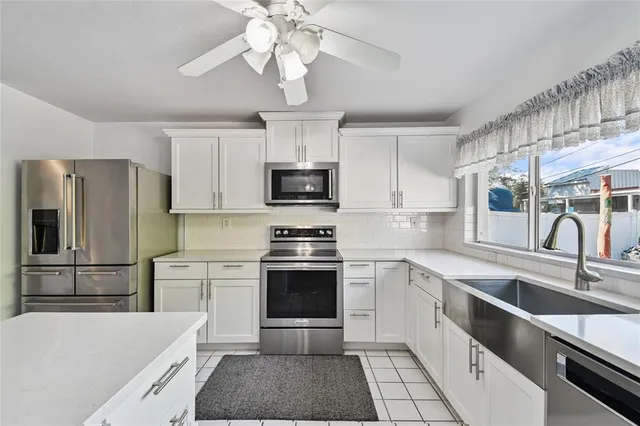 a view of kitchen with furniture and window