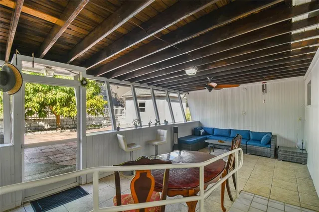 a dining room with furniture and a window