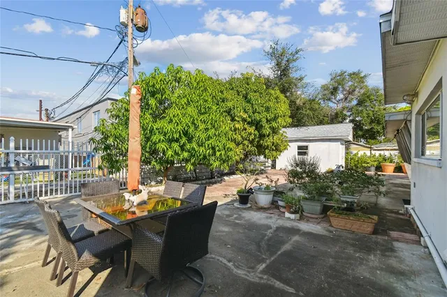 a utility room with dryer washer and a view of living room