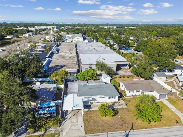 an aerial view of residential houses with outdoor space