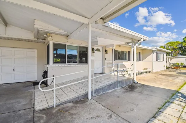 a view of a patio with table and chairs
