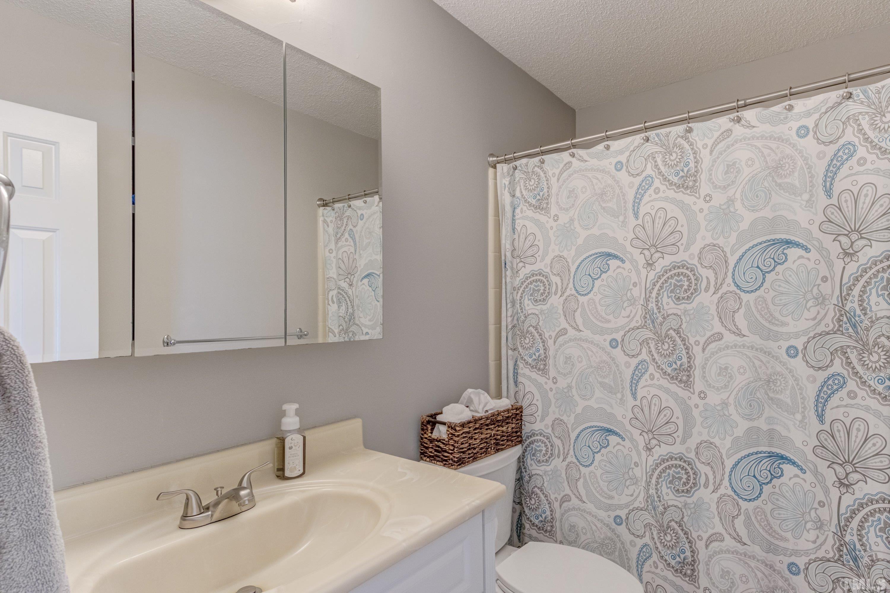 105 McIntire Lane Cary, NC 27513 - Photo 21 of 32 a bathroom with a sink and toilet