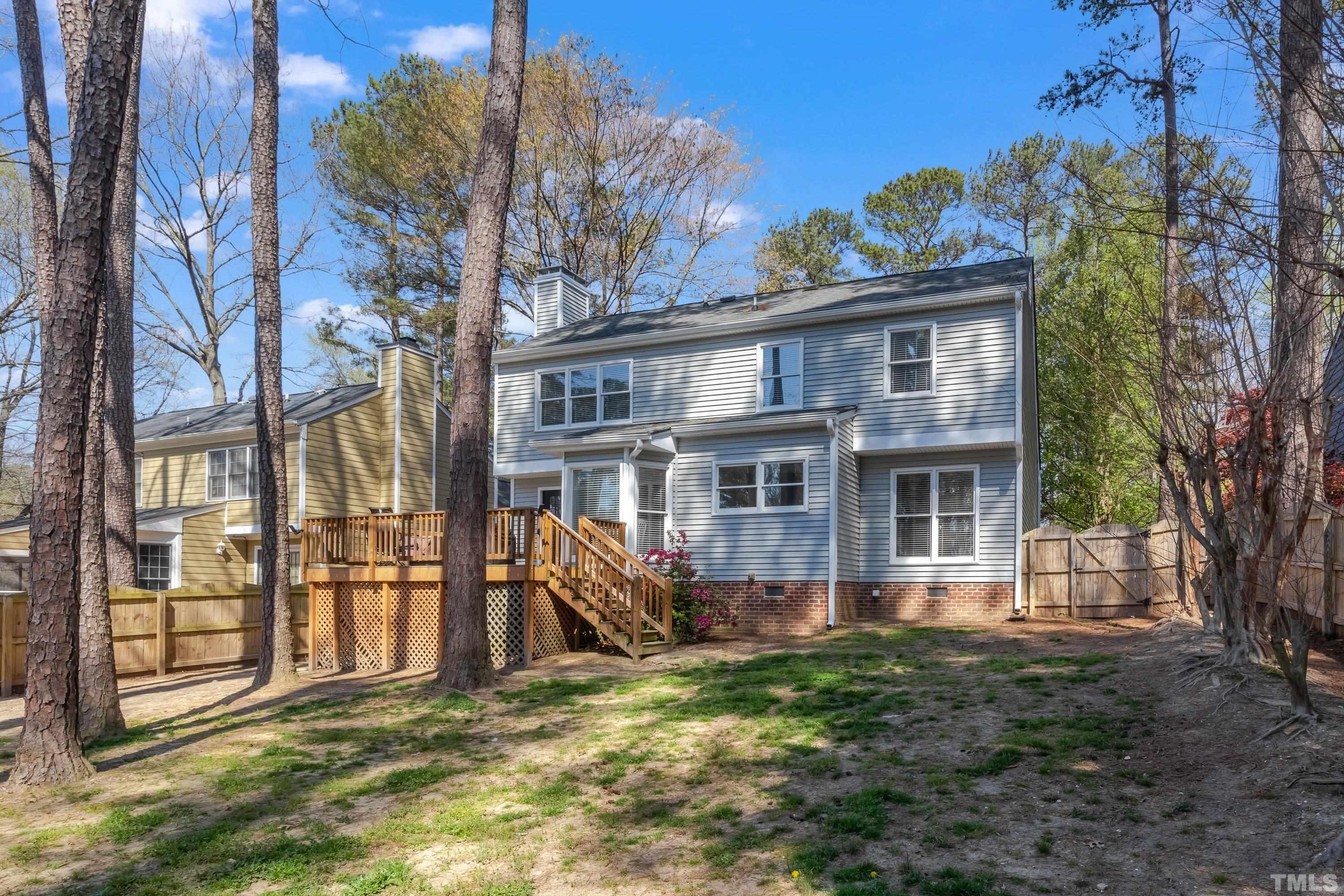 105 McIntire Lane Cary, NC 27513 - Photo 30 of 32 a view of a house with a window and wooden fence