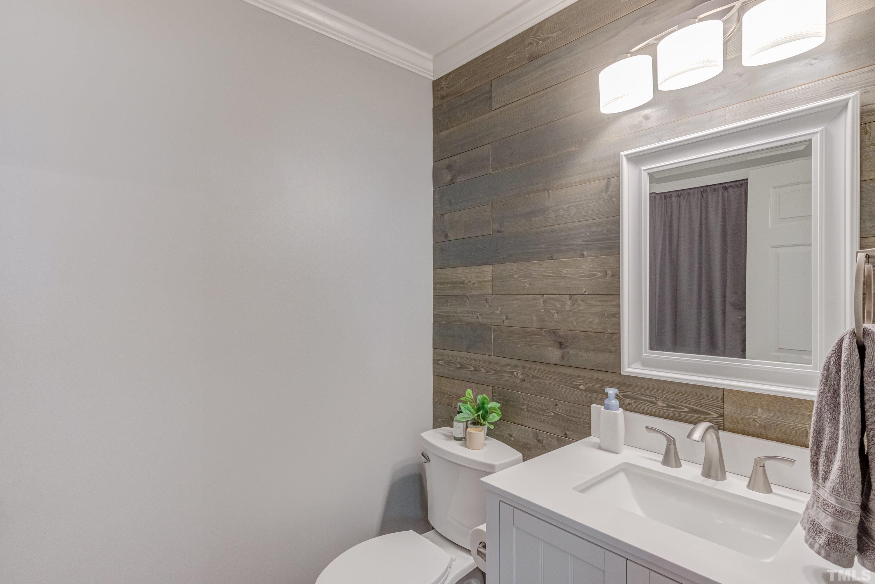 105 McIntire Lane Cary, NC 27513 - Photo 6 of 32 a bathroom with a sink vanity mirror and toilet