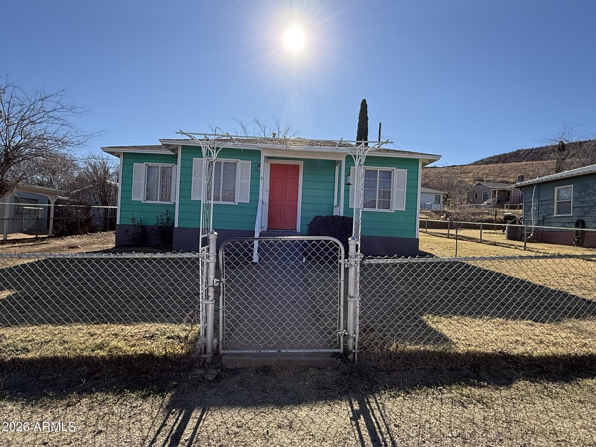 91 Neptune Avenue Bisbee, AZ 85603 - Photo 12 of 12 a front view of a house with a yard