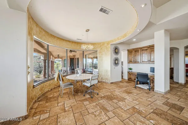 a living room with fireplace furniture and a large window