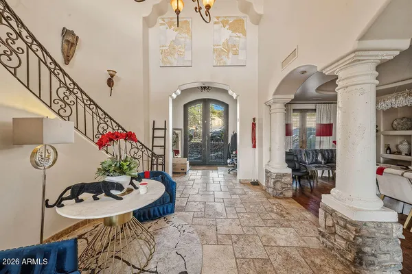 a living room with furniture and flowers