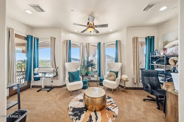 a living room with furniture and a large window