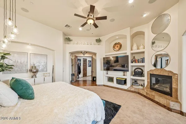 a spacious bathroom with a double vanity sink a mirror and a bathtub next to a window