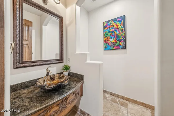 a bedroom with furniture and a flat screen tv